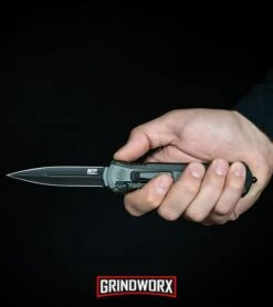 Smith & Wesson Spring Assisted Finger Actuator Tanto OTF Knife - Black Serr -Elite Knives Shop MP OTF Spring Assisted Spear Point Knife Gray Black BHQ 80731 kp in hand web large 2